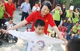 Yizumi Shows Loving Concern for Disabled Children